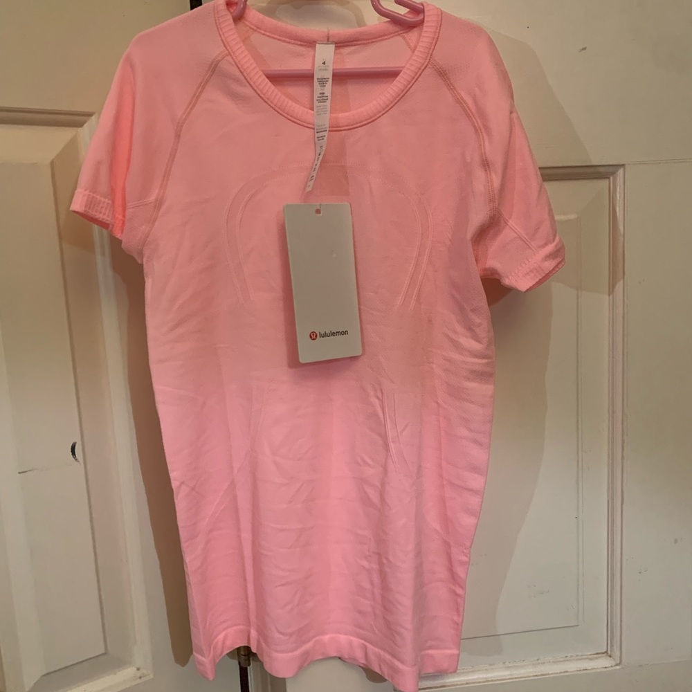 Brand new lululemon pink swiftly tec… never worn before… tags still on